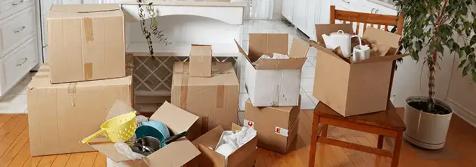 Packed moving boxes and household items in a kitchen before move-out or move-in cleaning, Dayton, OH.
